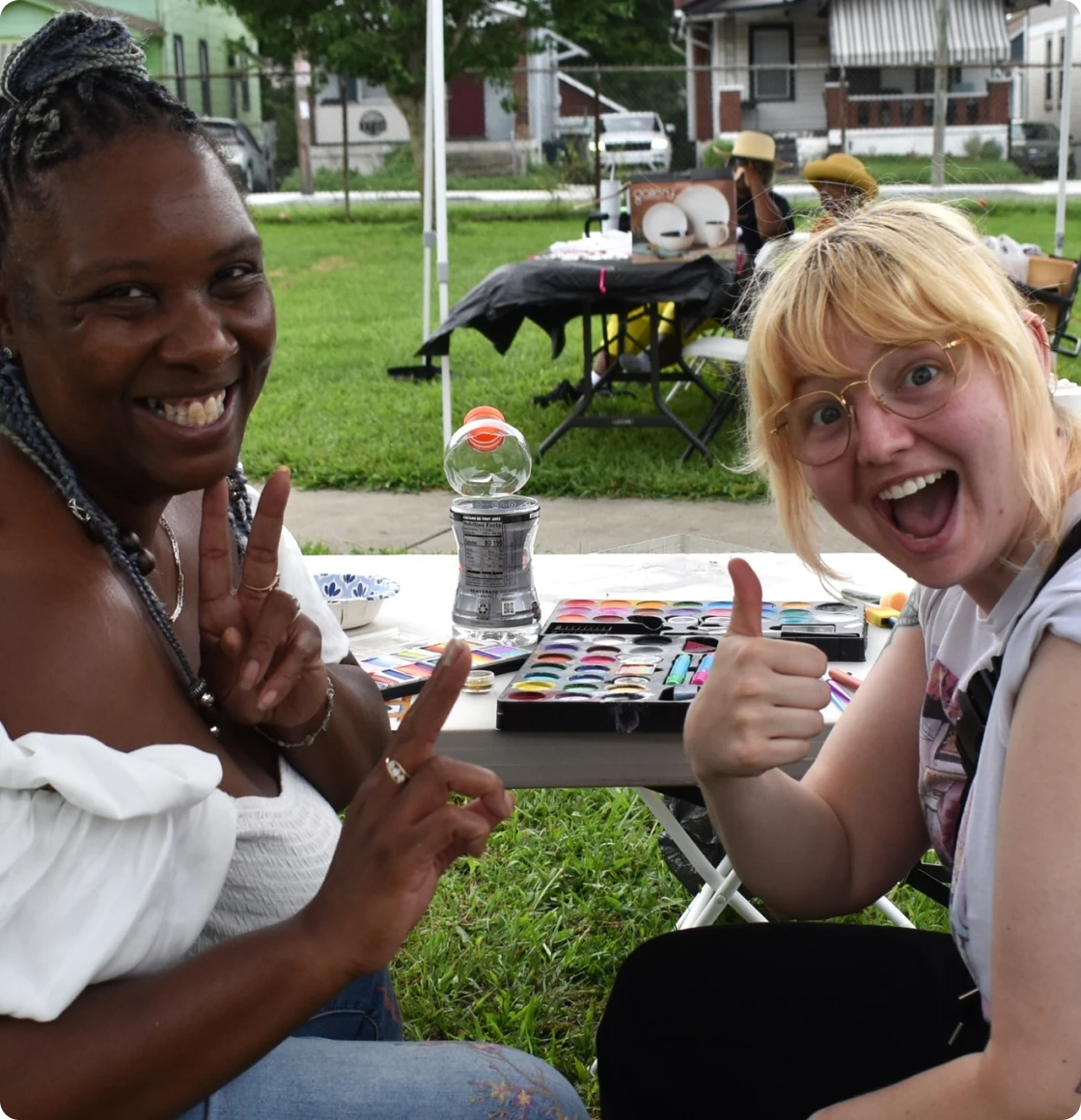 Women smiling at outdoor event